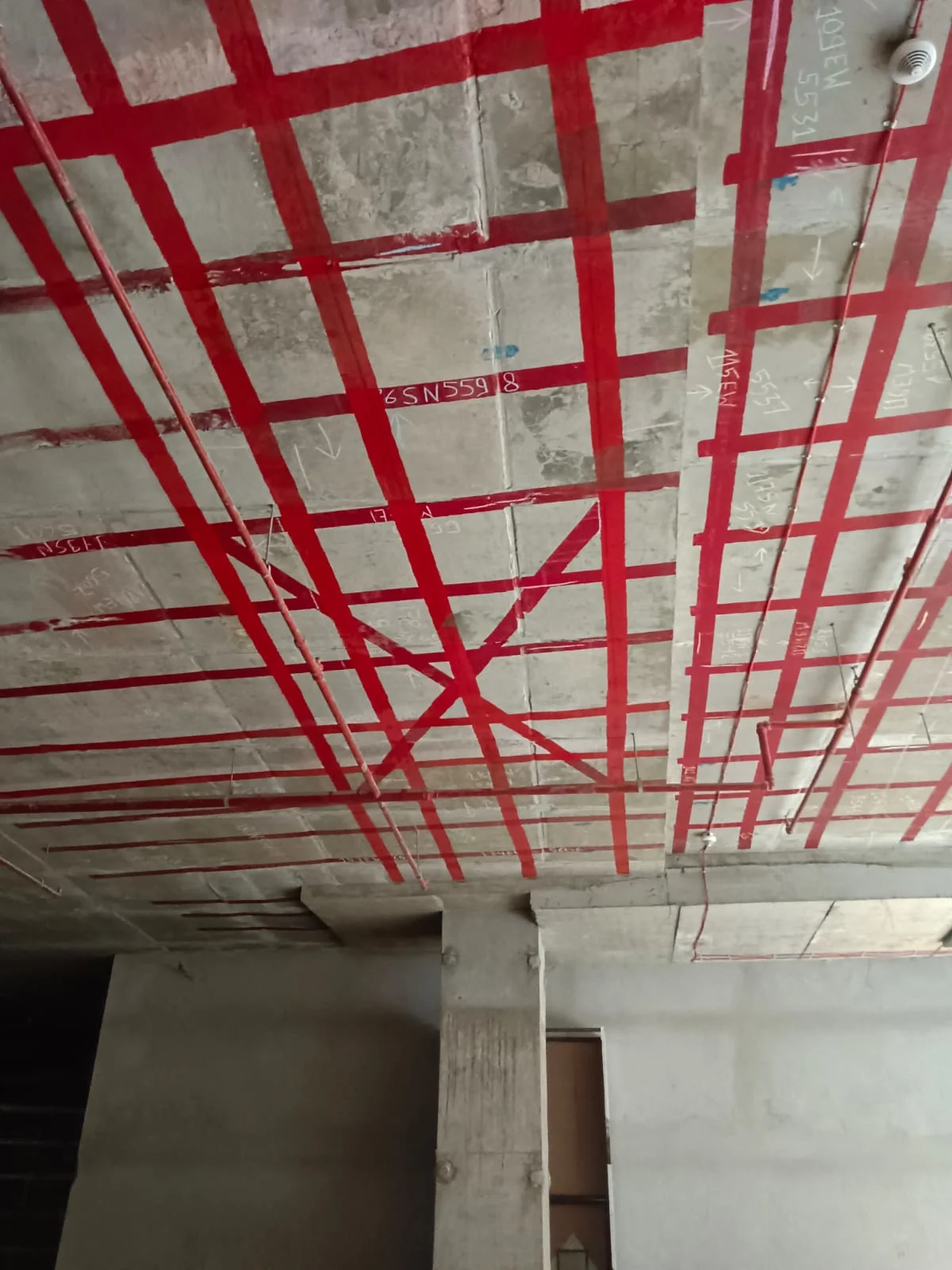 PT tendon grid marked on a post-tensioned floor slab soffit